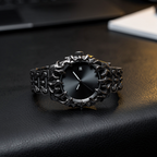 ValoraTime Specter watch lifestyle photograph resting on black leather at an executive desk setting.