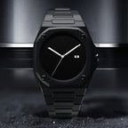 ValoraTime Eclipse watch with an all-black octagonal case and matte black dial, shown resting against a dark brushed metal surface.
